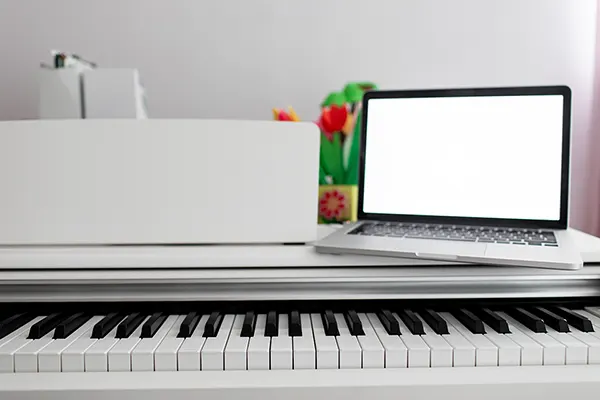 A person making a video call and taking notes